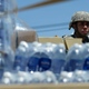 National Guardsmen arrive at Barrio Obrero in Santurce to distribute water and food among those affected by the passage of Hurricane Maria, in San Juan, Puerto Rico, Sunday, Sept. 24, 2017. Image credit: Carlos Giusti/AP Images